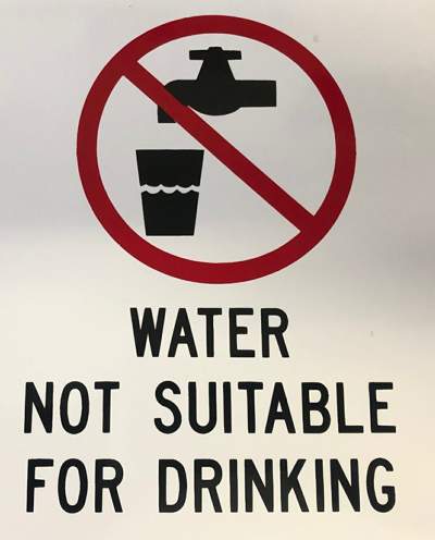 A sign that says "water not suitable for drinking"