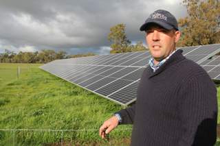 Karl Hooke with solar panels on his Serpentine farm