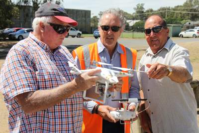 Retired Numurkah farmers John Blackman (left) and Ian Clark are pictured with GMW Draughting Officer and accredited drone pilot Graeme Eadie.