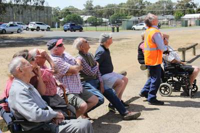 Members of the Numurkah Network watch the drone demonstration.