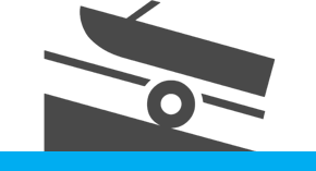 Speed boat on a trailer being lowered into water